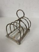 An 1898 Edinburgh silver toast rack likely Hamilton & Inches measures 9cm high and weighs 83grammes