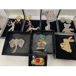 A collection of Butler & Wilson costume jewellery including brooches such as lady walking dog,