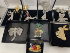 A collection of Butler & Wilson costume jewellery including brooches such as lady walking dog,