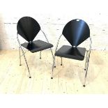 A Pair of post modern dining chairs, with ebonised seat and backs on tubular chrome supports, H85cm,