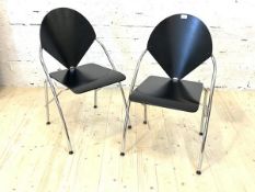 A Pair of post modern dining chairs, with ebonised seat and backs on tubular chrome supports, H85cm,