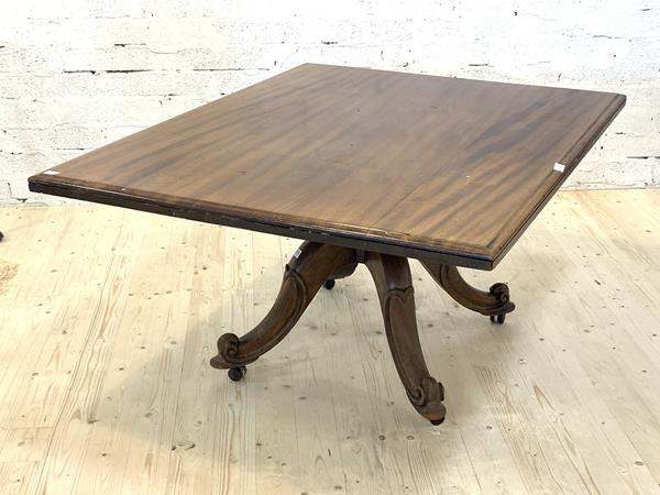 A Victorian mahogany tilt top dining table, the square moulded top over four scrolled and splayed