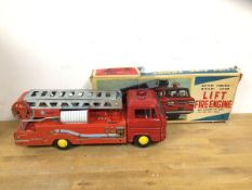 A mid 20thc Lift fire engine, made in Japan with original box measures 14cm x 37cm x 13cm