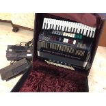 One Farfisa electronic accordion in original travelling case which measures 30cm x 59cm 53cm