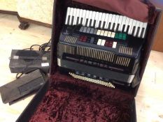 One Farfisa electronic accordion in original travelling case which measures 30cm x 59cm 53cm