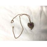 A costume jewellery heart shaped pendant on a 9ct gold belcher chain, measures 24cm, chain weighs