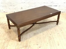 A Regency style mahogany low table, the quarter sawn and cross banded top over reeded supports