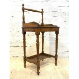 A Victorian mahogany wash stand, with a raised turned spindle back, galleried top, raised on