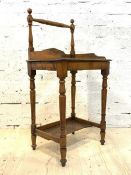 A Victorian mahogany wash stand, with a raised turned spindle back, galleried top, raised on