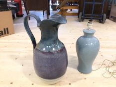 A modern glazed stoneware ewer measures, with handle, 48cm high along with a baluster shaped table
