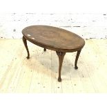 An early 20th century inlaid walnut oval low table, raised on cabriole supports, H44cm, W91cm,