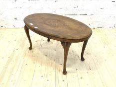 An early 20th century inlaid walnut oval low table, raised on cabriole supports, H44cm, W91cm,