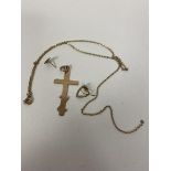 A 9ct gold crucifix measures 4cm along with a cable link chain a/f, heart shaped earring and another