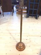 A vintage copper and wood handled laundry dolly, 80cm high