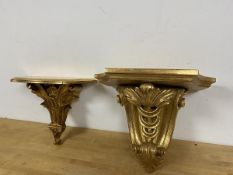 Two modern wall brackets with classically inspired foliate supports one marked Made in Italy verso