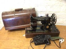 A Singer table top sewing machine with motor inscribed sewing motor catalogue BUK12-E along with