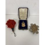 A 9ct gold medal inscribed verso Presented to Lance Corporal Wyatt First Blackwatch Regiment by R