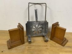 A mixed lot including two mid 20thc bookends and a metal book rest which measures 31cm high