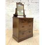 An early 20th century mahogany dressing chest, the swing mirror over two short and two long