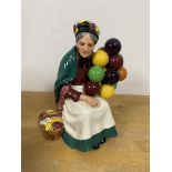 A Royal Doulton The Old Balloon Seller measures 20cm high