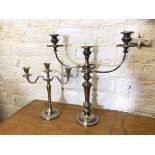 Two candelabra's both with central candle holder flanked by two arms, one Epns which measures 48cm x