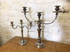 Two candelabra's both with central candle holder flanked by two arms, one Epns which measures 48cm x