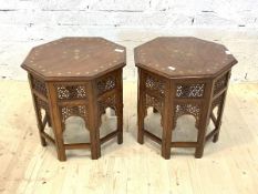 A Pair of Indian hardwood octagonal occasional tables, the tops with brass inlay over pierced