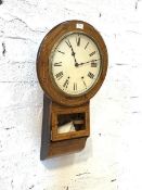 A late 19th century American drop dial wall clock, the inlaid walnut case enclosing a white