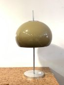 A mid century Guzzini style table lamp, circa 1960 - 1970, with a mushroom shade, on a chrome stem