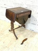 A Regency figured oak sewing table, the top with gadrooned and two drop leaves over fitted drawer