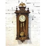 A Victorian Gustav Becker walnut cased Vienna regulator wall clock, the case with gilt egal surmount