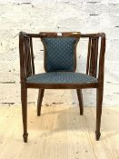 An Edwardian inlaid mahgogany bedroom chair, the upholstered back and seat raised on square