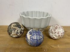A set of three 19thc carpet boules a/f measure 8cm diameter and a jelly mould (4)