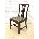 A 20th century Georgian style mahogany dining chair, with upholstered seat, raised on square