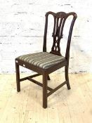 A 20th century Georgian style mahogany dining chair, with upholstered seat, raised on square