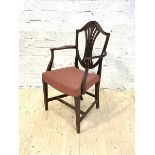 An early 20th century Hepplewhite style carver dining chair, with upholstered seat and square