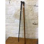 A malacca walking stick with white metal knop, measures 92cm and another walking stick ebonised with