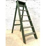 A 20th century set of green painted pine six rung stepladders, H140cm