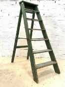 A 20th century set of green painted pine six rung stepladders, H140cm