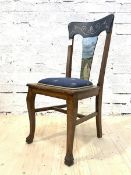 An early 20th century oak side chair, the shaped crest rail over splat painted with rural landscape,