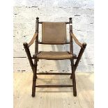 A late 20th century mahogany framed campaign style chair, the simulated bamboo folding 'x' frame,