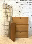 A Staples Ladderax teak modular storage system, comprising of three gilt painted metal supports,