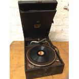 An HMV travelling gramophone measures 14cm x 42cm x 29cm