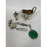 A group of silver objects including a late 19thc Chester silver milk jug measures 9cm high along