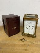 A four glass carriage clock inscribed to dial McDowell Bros Dublin measures 19cm high with handle