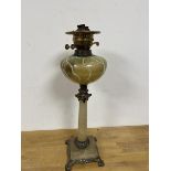 A late 19th early 20thc oil lamp the glass reservoir of veined design on stone column base with