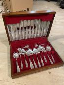A mid century cutlery canteen with knives, forks, serving spoons, coffee spoons etc interior with