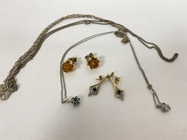 A pair of 9ct gold drop earrings with diamond points also two stud 9ct gold earrings with amber