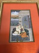 A modern Indian miniature painting in the Mughul style of a couple on rug, paper label verso