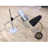 A mid century style table lamp, the conical pierced shade with black matte finish on brass effect